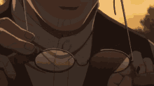 a close up of a person holding a pair of glasses in their hand