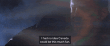 a man in a suit says " i had no idea canada could be this much fun " in a dark room