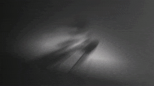a black and white abstract background with a swirl of lines