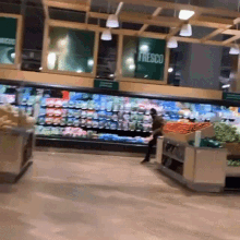 a grocery store has a sign that says fresco on it