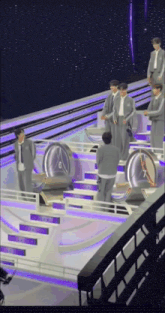 a group of men standing on a stage with a clock in the middle