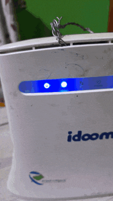 a white device with the word idoom on the front