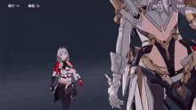 a woman in armor is standing next to another woman in armor in a video game .