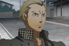 a man with a houndstooth collar has a yellow circle on his chest