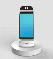 a white and black robot with three shelves on a white podium