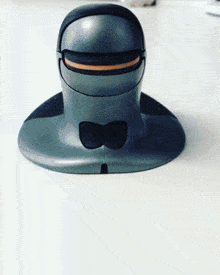a gray and black item with a bow on it