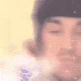 a close up of a man 's face with sparks coming out of his eyes .