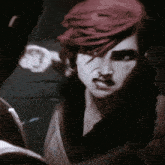 a woman with red hair is being punched by another woman