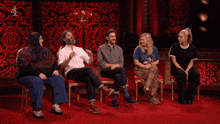 a man with curly hair and a beard says " destroy " on a red background