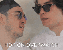 two men are looking at each other with the words hop on overwatch above them