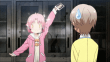 a girl in a pink jacket is holding up a card with tokyo mx 1 written on the bottom