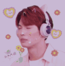 a young man wearing headphones with cat ears on his head is laughing
