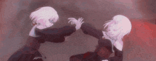 two anime girls are standing next to each other and reaching out towards each other .