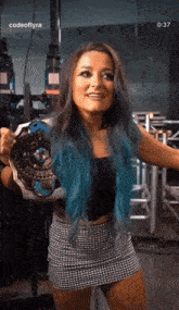a woman with blue hair is holding a championship belt with the time 0:37