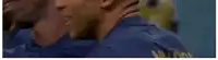 a soccer player in a blue jersey with the number 7 on it is kneeling on the field .