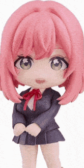a figurine with pink hair and green eyes