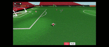 a soccer game is being played on a computer screen with a red stadium in the background