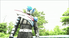 a man in a superhero costume with a belt that says ' fg ' on it
