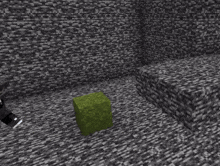 a minecraft character is crawling on the ground next to a green cube .