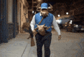 a man wearing a mask of a bull carrying a gun
