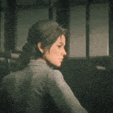 a woman wearing a plaid shirt is looking at the camera