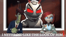 a man and a woman are sitting in front of a screen with a cartoon character on it .