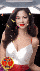 a woman in a white top is surrounded by confetti and a one voice family one passion sticker