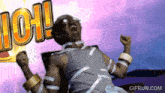 a man is sitting in a chair with his arms in the air and the word ioh is behind him