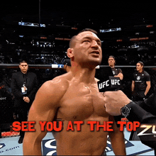 a shirtless ufc fighter is interviewed by a reporter