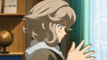 a girl in a brown jacket looks out a window