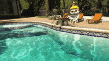 a pool with a statue of a cat in the middle