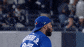 a baseball player wearing a blue jersey with the name perrero jr on the back