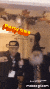 two men are dancing in front of a sign that says party time on it