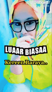 a woman wearing glasses and a scarf with the words luaar biasaa keren baraya