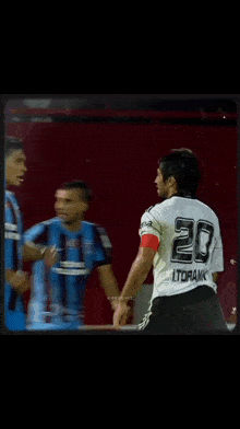 a soccer player wearing a shirt that says turk telekom on it