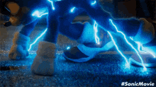 a close up of a person 's feet with blue lightning coming out of them .
