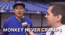 a man talking into a microphone with the words monkey never cramps on the bottom