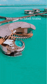 a welcome to saudi arabia poster with a swimming pool