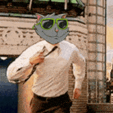 a man in a white shirt and tie is running with a cat mask on his head