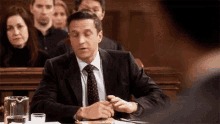 Standing Up Acknowledgment GIF - Standing Up Acknowledgment Fixing Tie GIFs