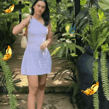 a woman in a white dress stands in a garden with butterflies flying around her