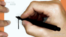 a hand is holding a pen in front of a screen that says draw cute things on it