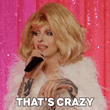 a woman singing into a microphone with the words that 's crazy written below her