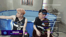two men are sitting in a pool with the words insane crash csgo skins on the screen