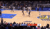a basketball game is being played in front of a crowd and the scoreboard says dal 92 chi 97