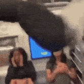a blurry picture of a person 's face with a blue screen in the background