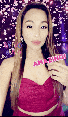 a woman in a pink top with the words amazing written on her chest
