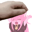 a pink anime girl is being petting by a cat .