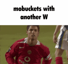 a soccer player in a red jersey with the words mobbuckets with another w on the bottom