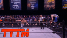 a wrestling match is being broadcast live on tnt and tbs